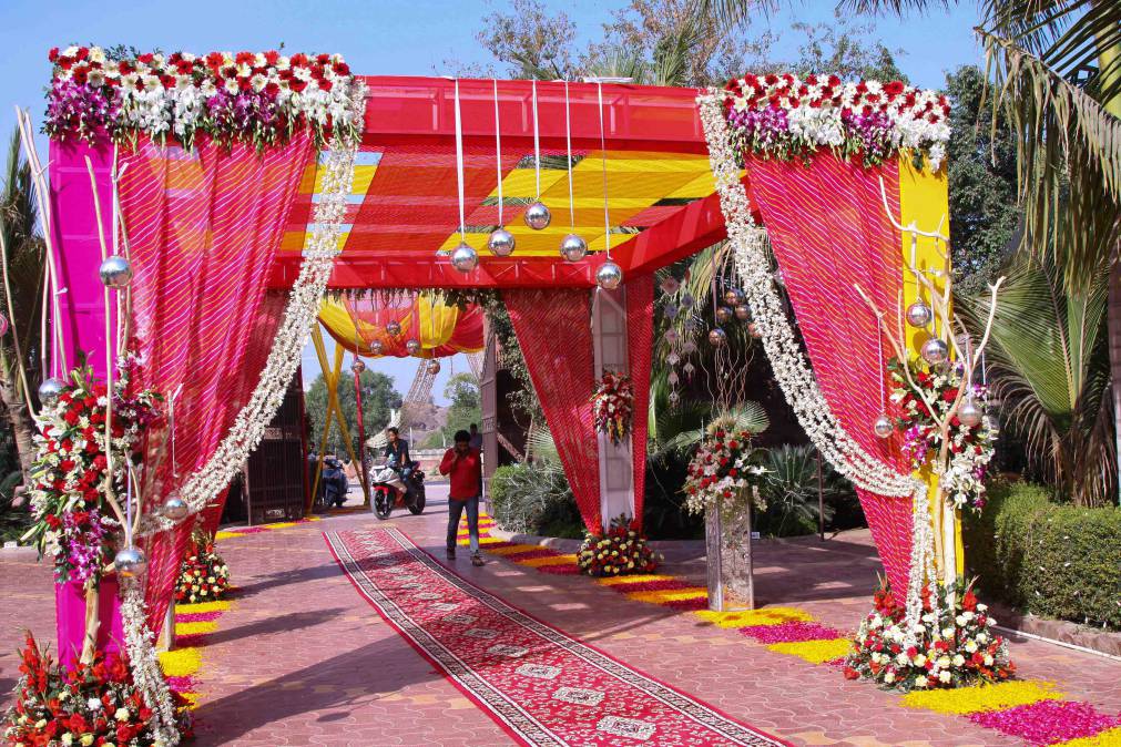 Mandap aisle design with floral structure and guest-view symmetry